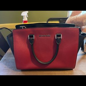 Red and black Michael Kors satchel